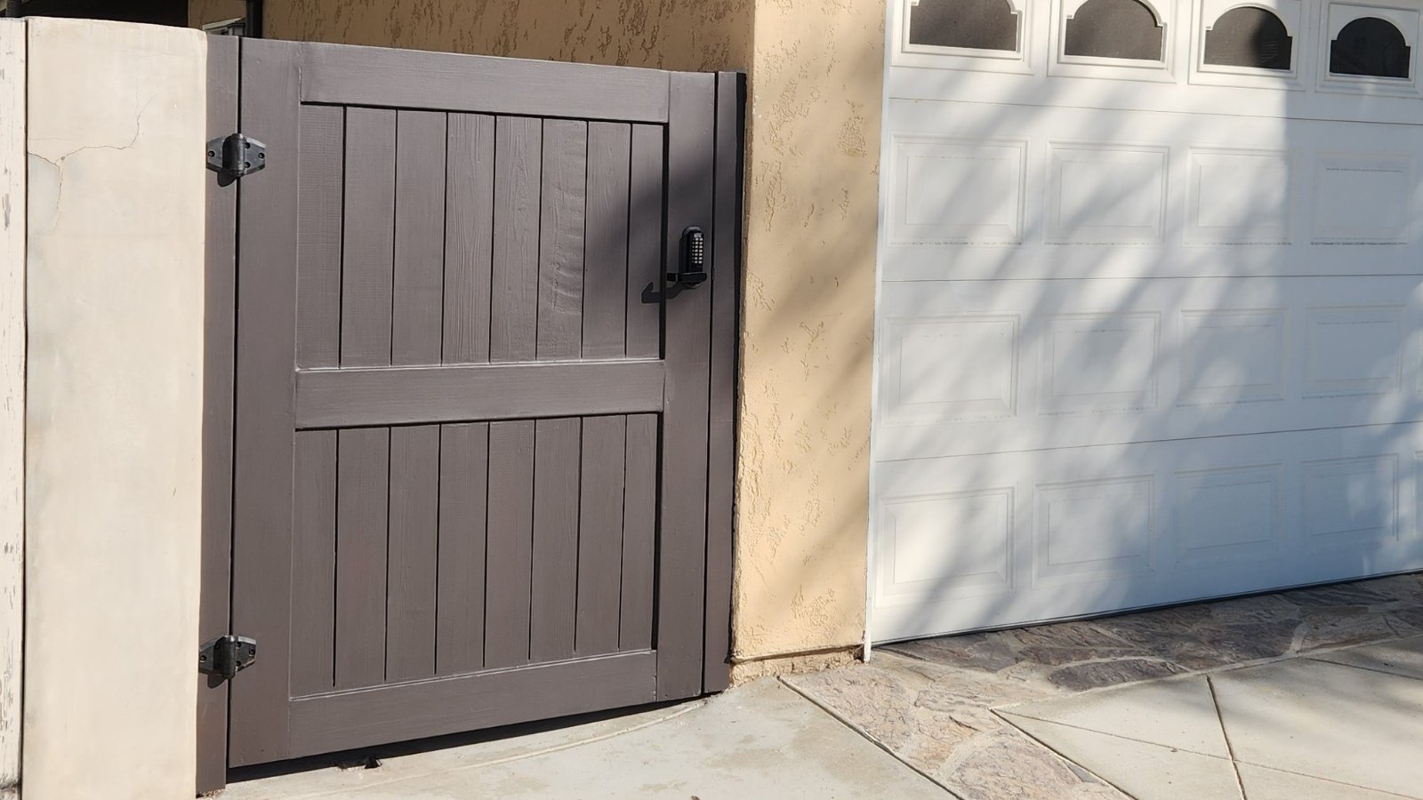 Wooden gate next built with secure and durable gate hardware.