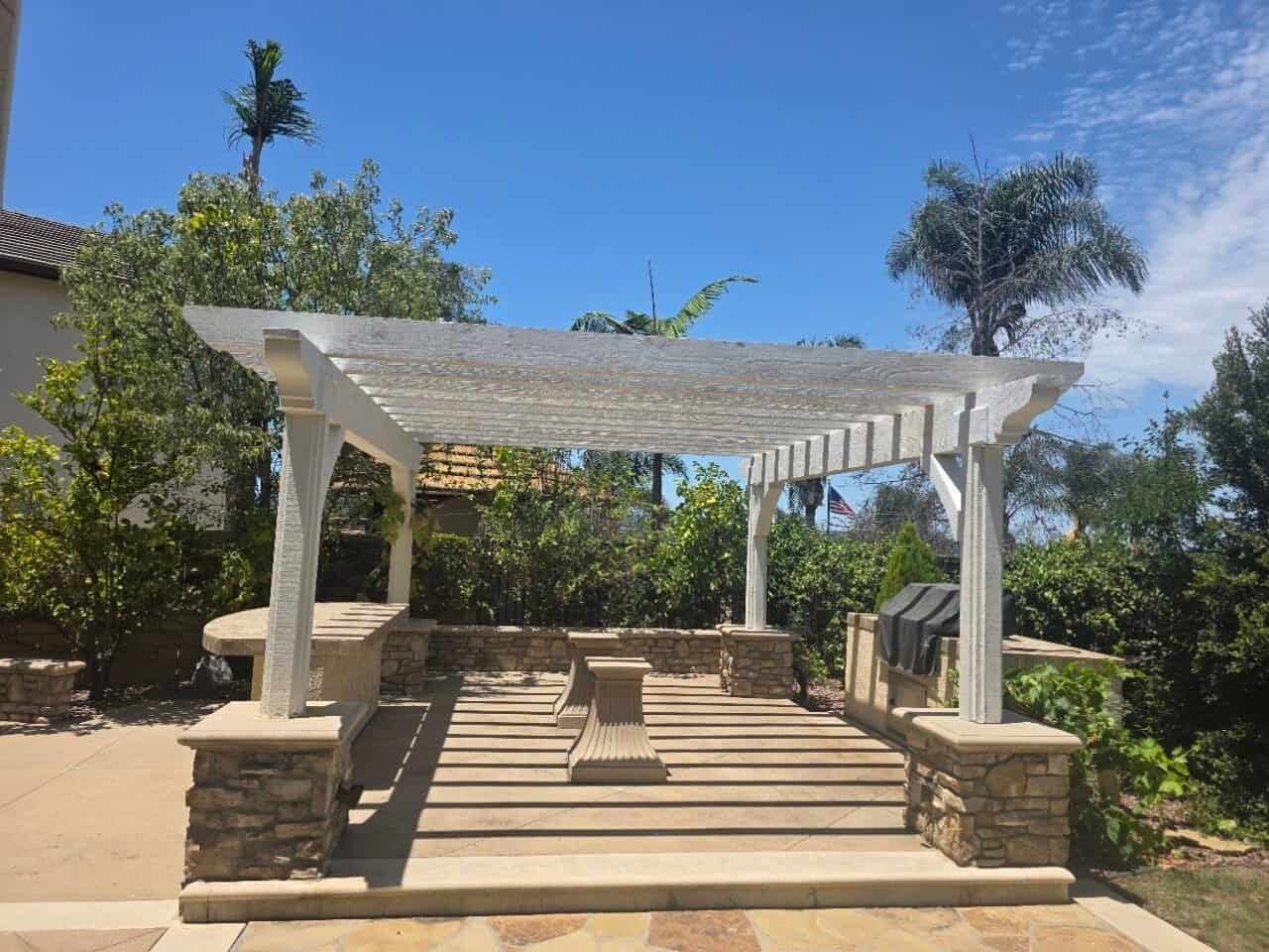 Pergola over a barbecue in a gated community.